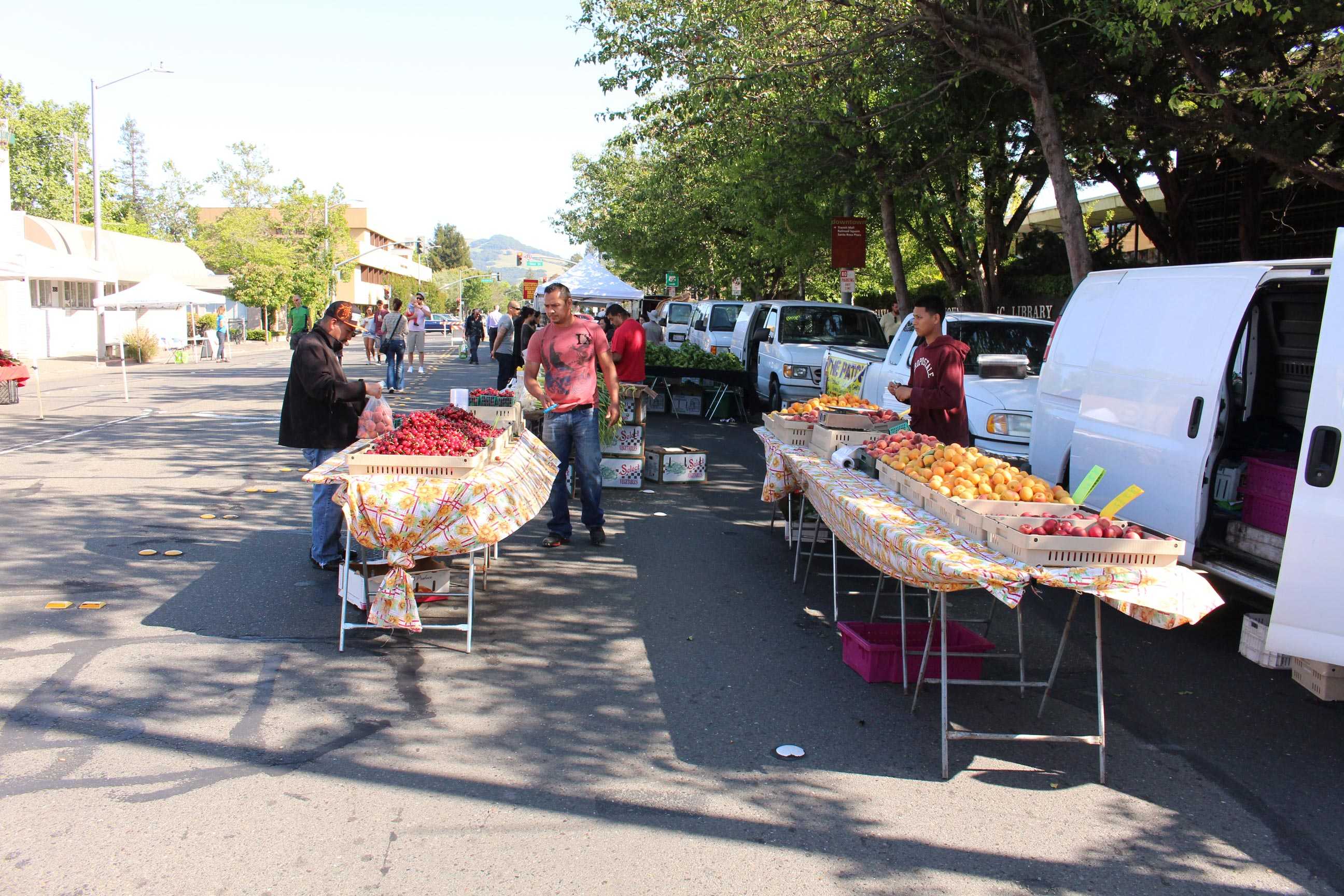 Farmers set up for the first Wednesday Night Market of the year, where students can buy fresh produce, local honey and hand-crafted treats on Fourth Street.
