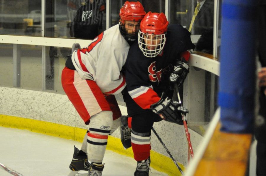 Polar Bear Forward Josiah Nikkel gets slamed into the glass during SRJC's Nov. 10 game against Northern Arizona University.