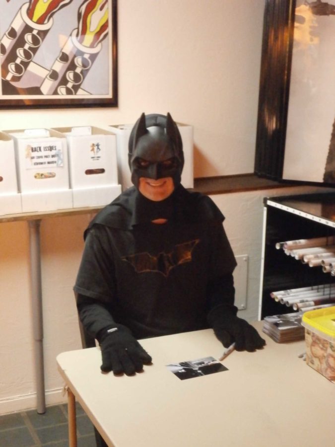 An SRJC student, a.k.a. Petaluma Batman, helps welcome the newly opened Brian’s Comics.