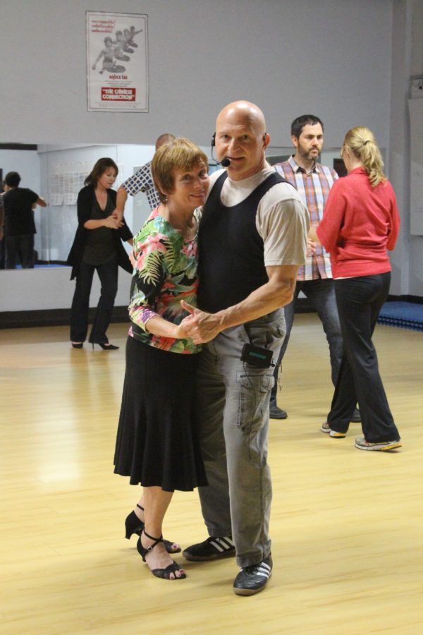 Instructors Annie and Denny lead their students during a swing dance class.