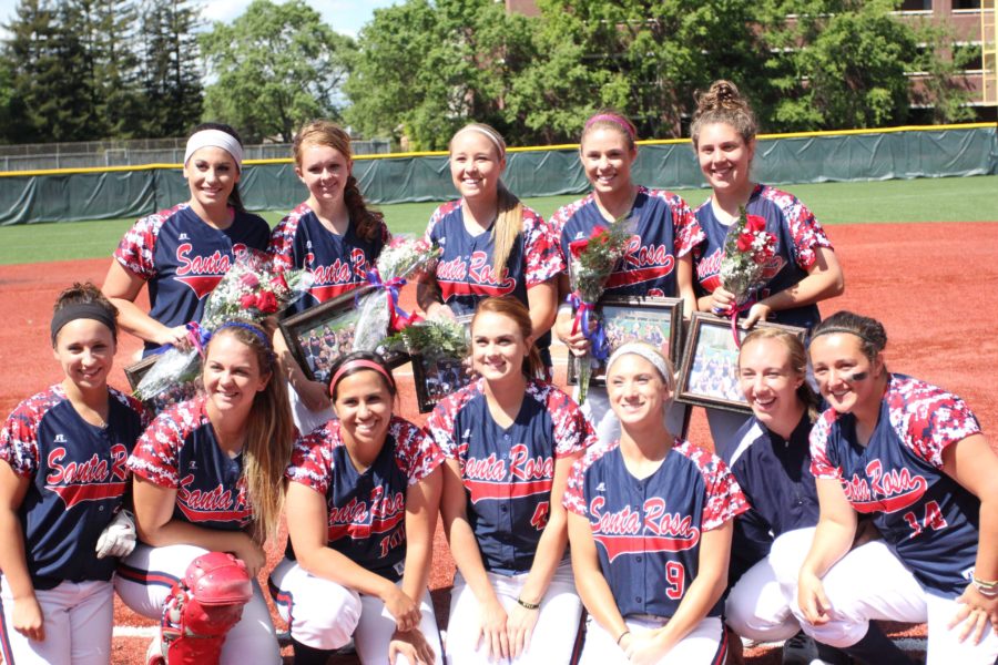 The SRJC softball team poses for a team photo on Sophomore day to celebrate their final year playing for the team.