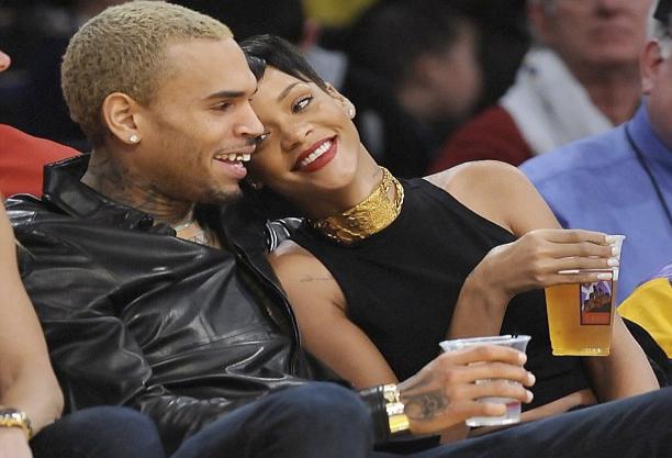 Recently reunited Chris Brown and Rihanna cuddle at a Lakers game in December.
