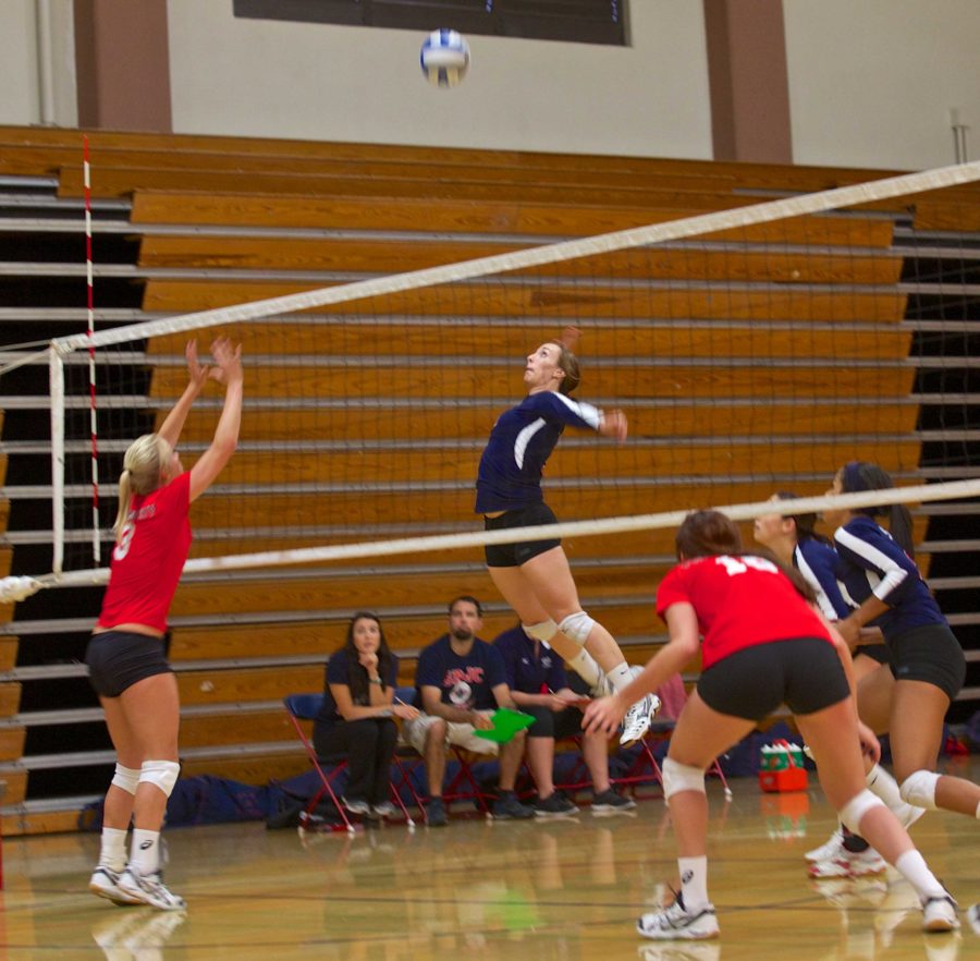 SRJC sophomore Courtnie Morton spikes the ball against Fresno City College Sept. 20 for the first game of the day in Santa Rosa.