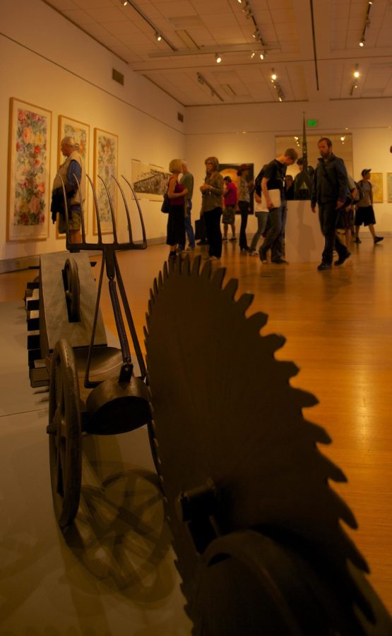 A crowd gathers to experience the “Tradition of Mayhem” exhibit’s opening night at the Santa Rosa Junior College’s Doyle Library art gallery Sept. 19.