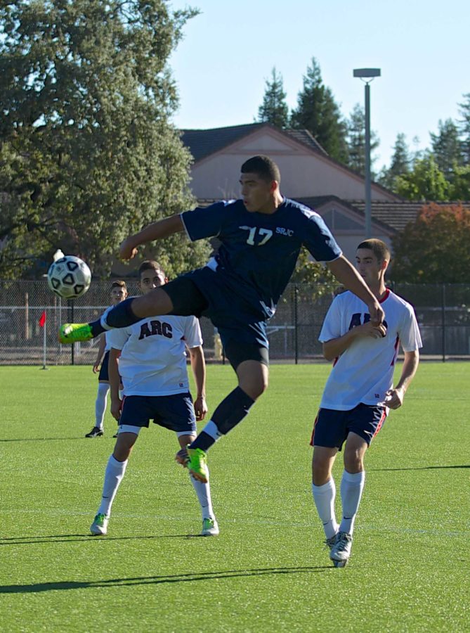 Freshman forward Omar Nuno leaps in into the air to take the ball away from American River College Sept. 27 in Santa Rosa.