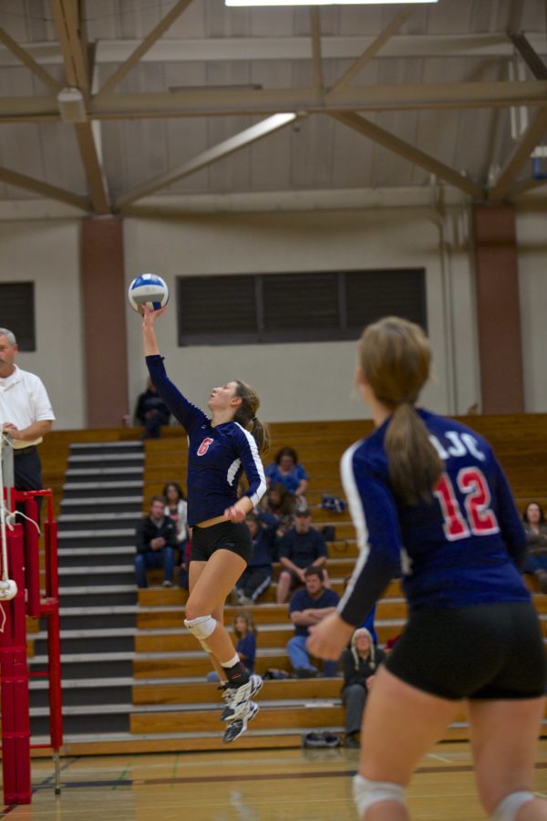 Megan Johnson dumps the ball over the net against Delta Nov. 8 at Haehl Gym in Santa Rosa.