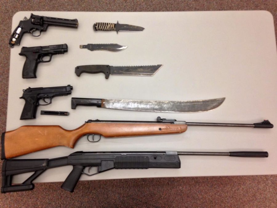 Three pellet handguns, two pellet rifles, three sixed-blade combat knives and a 27-inch machete were found in Grgichs car.