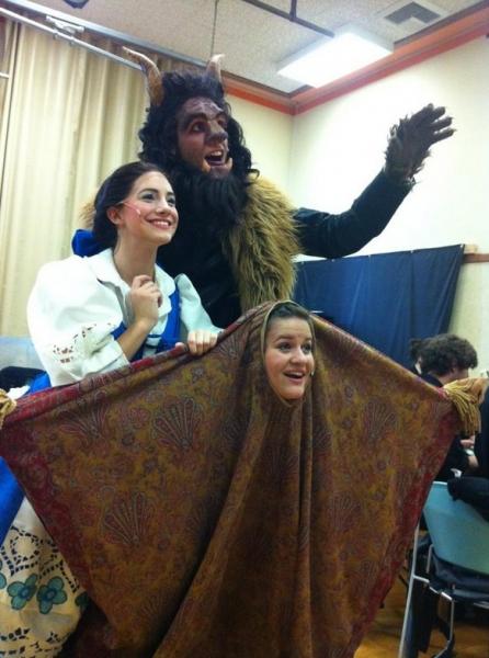 Belle, Beast and Carpet pose for the camera during Beauty and the Beast.