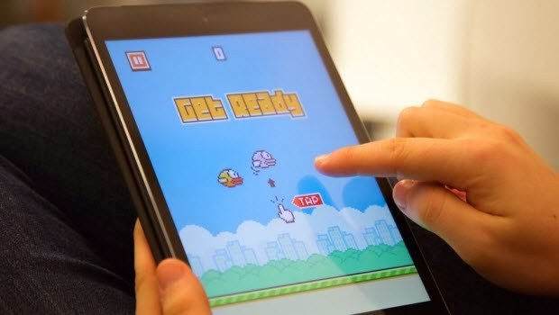 A player taps away to desperately beat their own high score on the incredibly addicting game Flappy Bird.