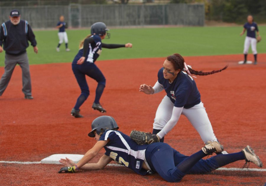 Santa Rosa Junior College Bear Cub Chauntel Cesna tags out the Mendocino College baserunner at Marv Mays Field Oct. 27.