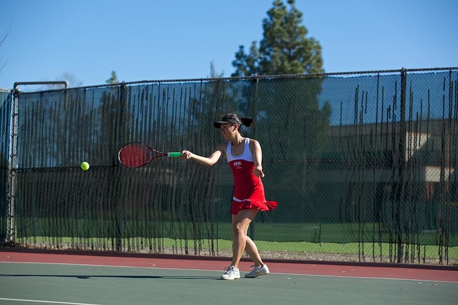 Angel Tran returns service against Folsom Lake Feb. 21 at SRJCs home tennis court.