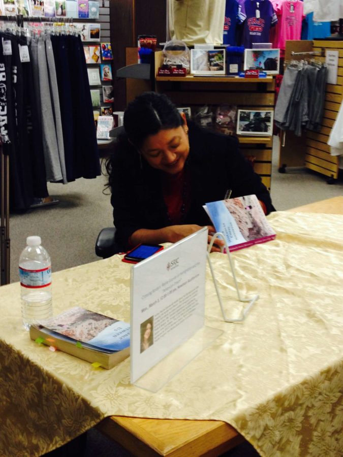 Reyna signing books in the SRJC bookstore