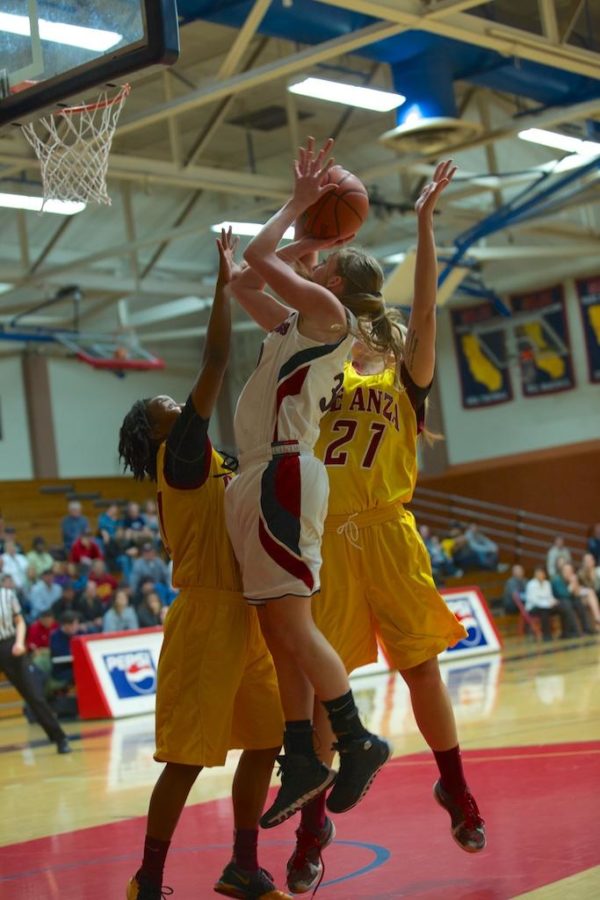 Gretchen Harrigan shoots over the stingy defense De Anza College in Round 2 of the playoffs Feb. 28 in Haehl Gym Santa Rosa.