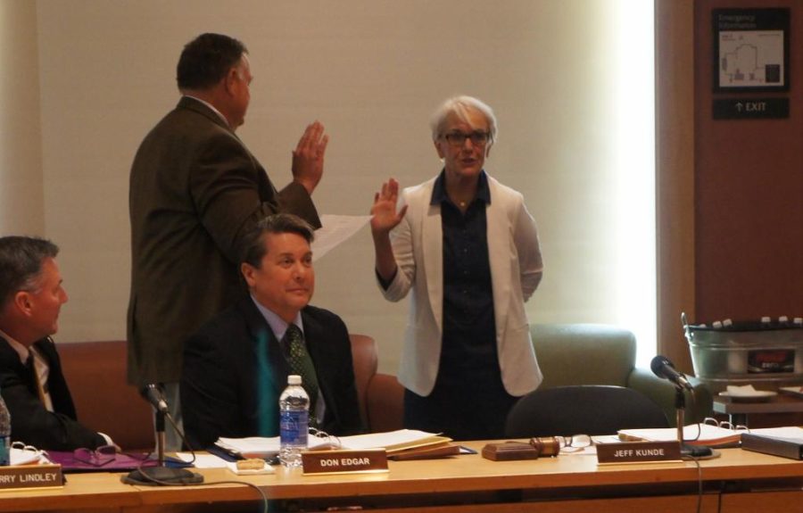 Jeff Kunde, President of SRJC's Board of Trustees, swears in Kathleen Doyle as a Board Member at the Board meeting March 11.