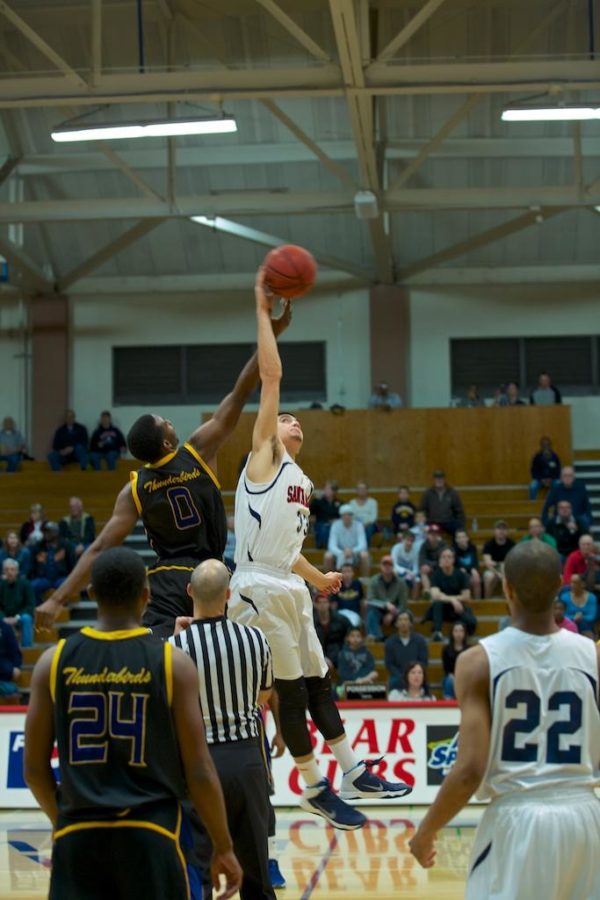 Brian Johnson wins the tip off to begin the game against Merritt March 1 at Haehl Gym Santa Rosa.