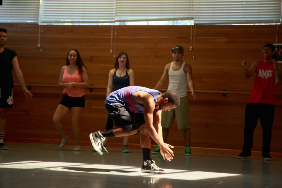 James Dory practices his dance in the middle of a circle of his peers. Dory and his fellow students will perform May 9-11 at 8 p.m. in Burbank hall.