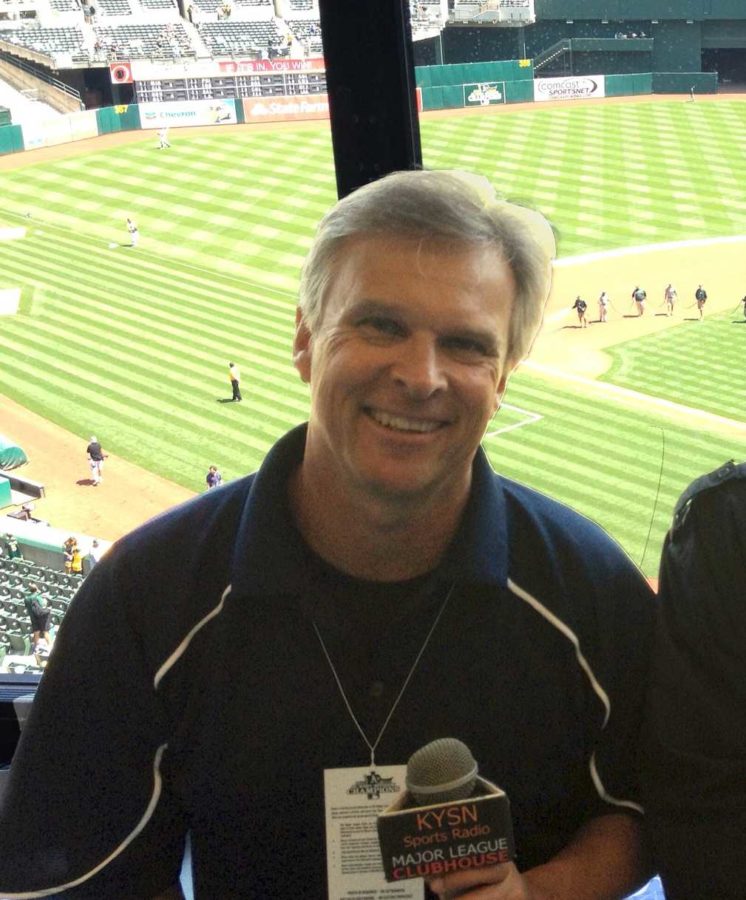 Cox poses in his broadcasting station at Youth Sports Network, founded 17 years ago.