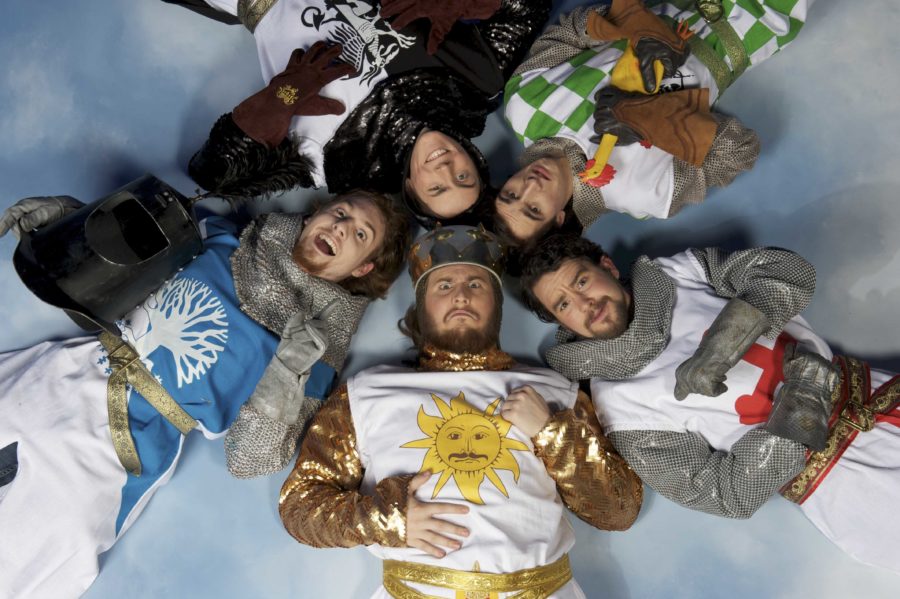 King Arthur (centered) and his knights of the Round Table pose in a circle.