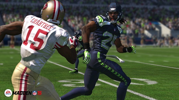 Roger Sherman from the Seattle Seahawks tries to intercept the ball from San Francisco 49ers offense player Michael Crabtree in this years “Madden 15.