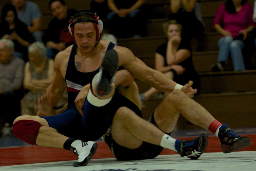 Freddie Duerr looks to escape from the bottom position against his Chabot
opponent Oct. 3 in the SRJC Tauzer Gymnasium.