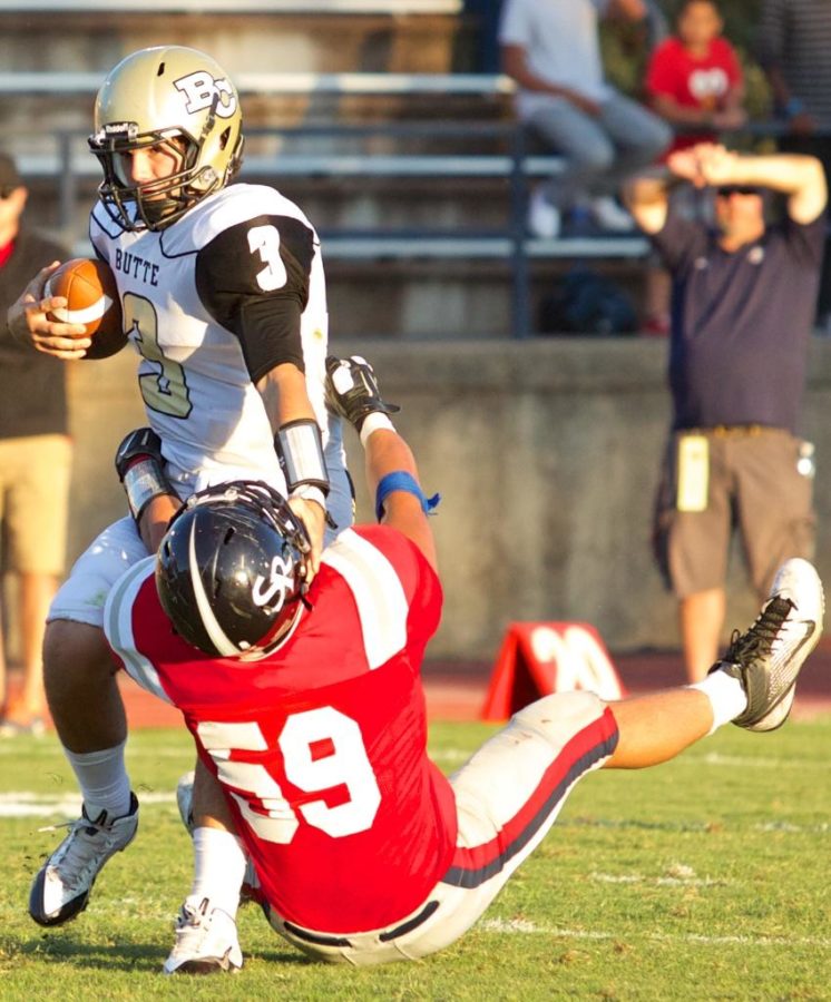 Bear Cubs John Amandoli pulls Butte Colleges QB Zach Kline to the ground for a sack Sept. 13 at Bailey Field Santa Rosa.