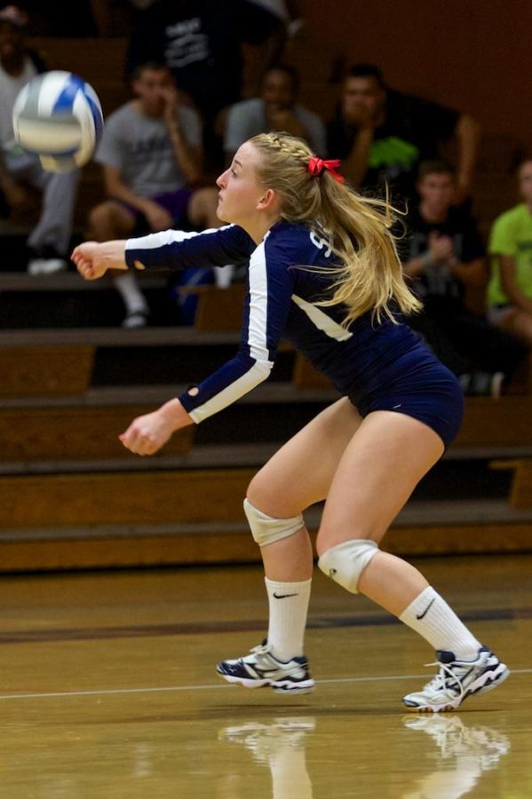 Bryce Gevas makes a one handed dig saving a point from being scored by Sierra College Oct. 8 in Haehl Pavilion Santa Rosa.