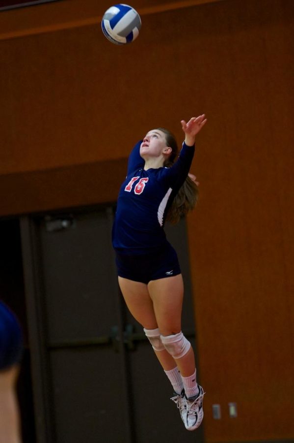 Sophia Reoutt sends the ball up, following right behind to complete her jump serve towards Sierra College Oct. 8 in Haehl Pavilion Santa Rosa.