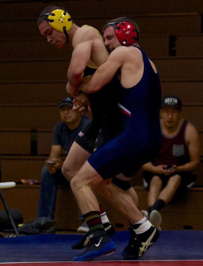 Richard Morris picks up his Chabot College opponent on the out of bounds line to prevent his attempt at escape Oct. 3 in Tauzer Gym Santa Rosa.