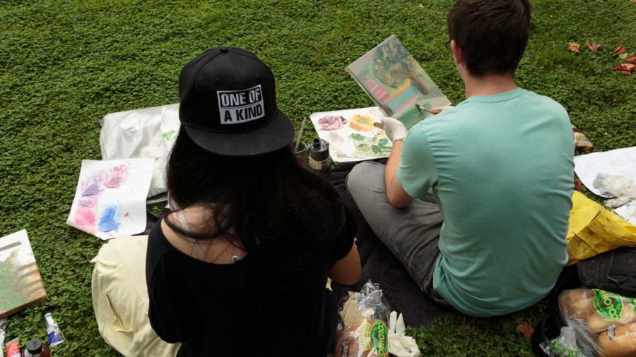  Deborah Kirklin's Art 14 beginning painting students Y Pham, 19 (left) and Dylan Stefanisko, 21 (right) working en plein air this fall on the SRJC campus. (Jeanine Flaton-Buckley/Oak Leaf)