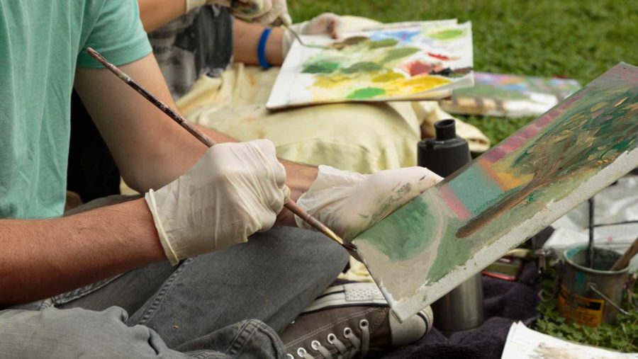  Deborah Kirklin's Art 14 beginning painting students Dylan Stefanisko, 21 (foreground) and Y Pham, 19 (background) working en plein air this fall on the SRJC campus. (Jeanine Flaton-Buckley/Oak Leaf)