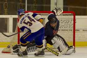 Dominic  Jones uses his butterflies, stopping the shootout scoring attempt by SJSU's Schlayer Krawczum. 