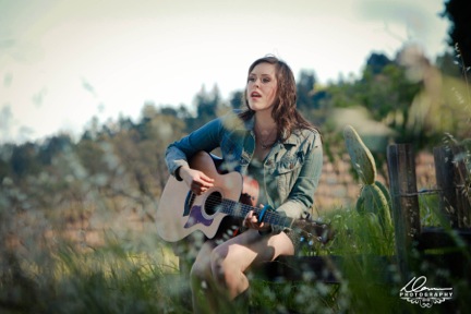 Local Windsor talent Sarah Defor, playing the guitar and singing. 