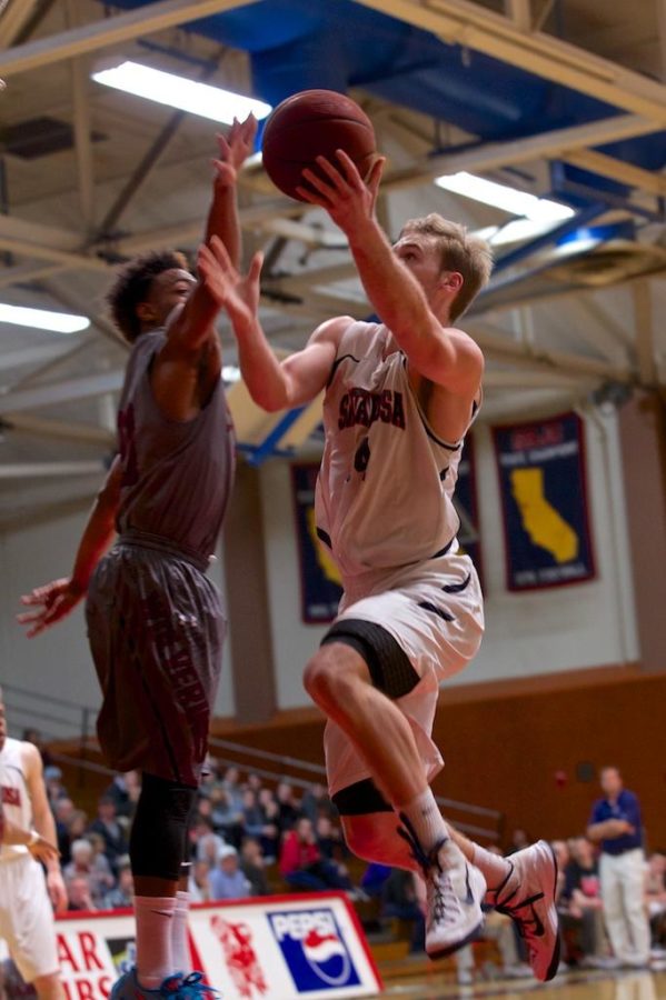 Corey Hammell serves the ball to the hoop as one would serve pasta over their lips against Sierra College Feb. 6 at Haehl Pavilion.