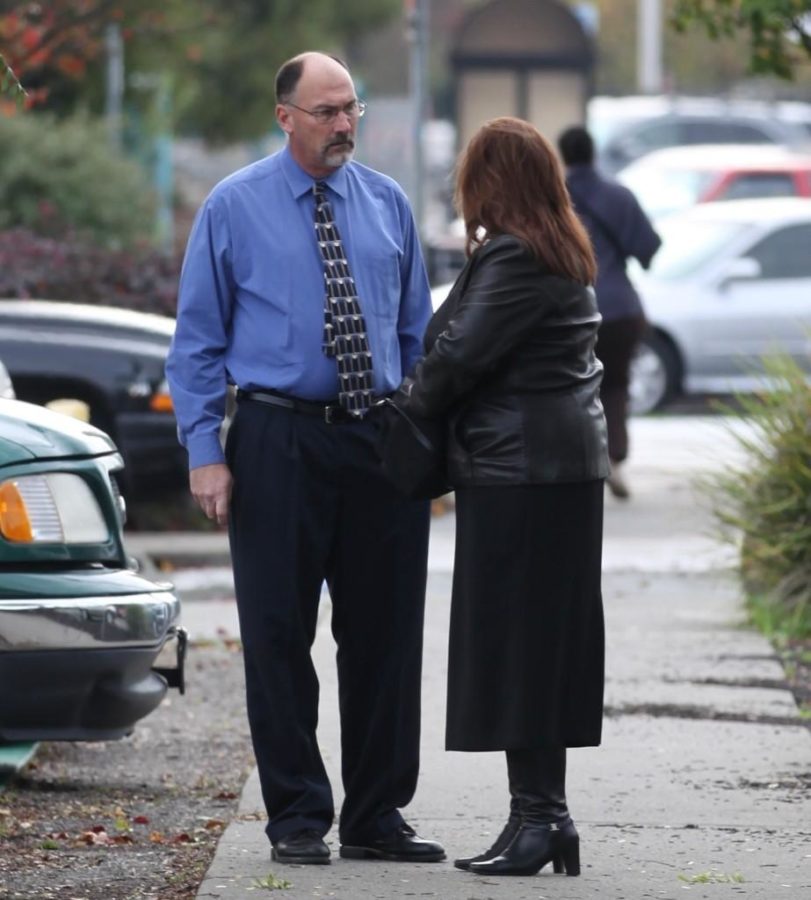 Jeffrey and Karen Holzworth standing outside the court, discussing the trial on Dec. 2012 