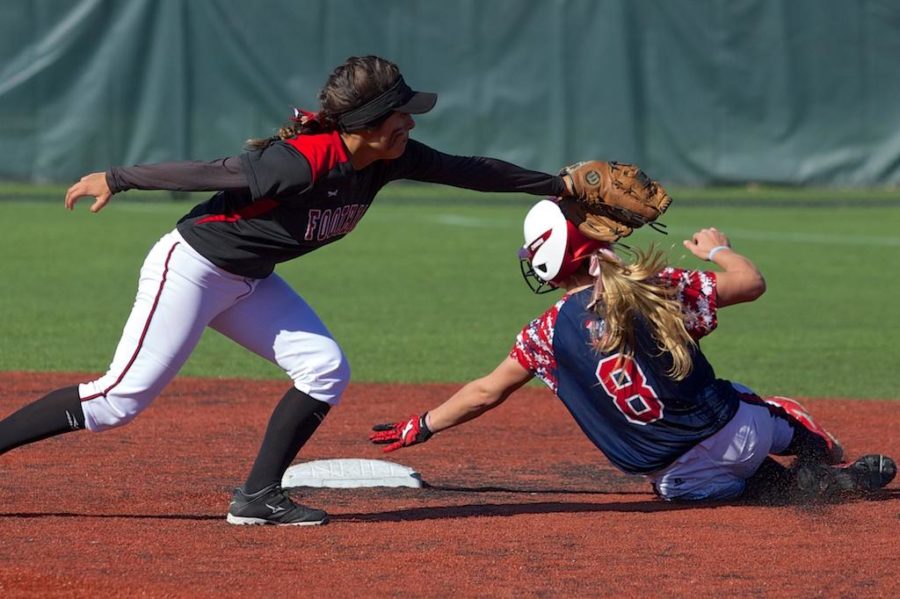 Becca Steiner slides under the swiping tag Foothill Colleges infielder to steal second base Feb. 21 at Marv Mays Field.