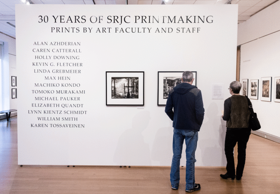 A couple tours "30 years of SRJC Printmaking" at the Doyle Library.