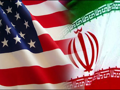 American and Iranian flags contrast much like the nations they represent.