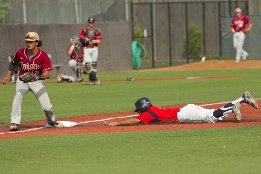 Jake Scheiner steals third base on a passed ball against Sierra College April 24 at Sypher Field.