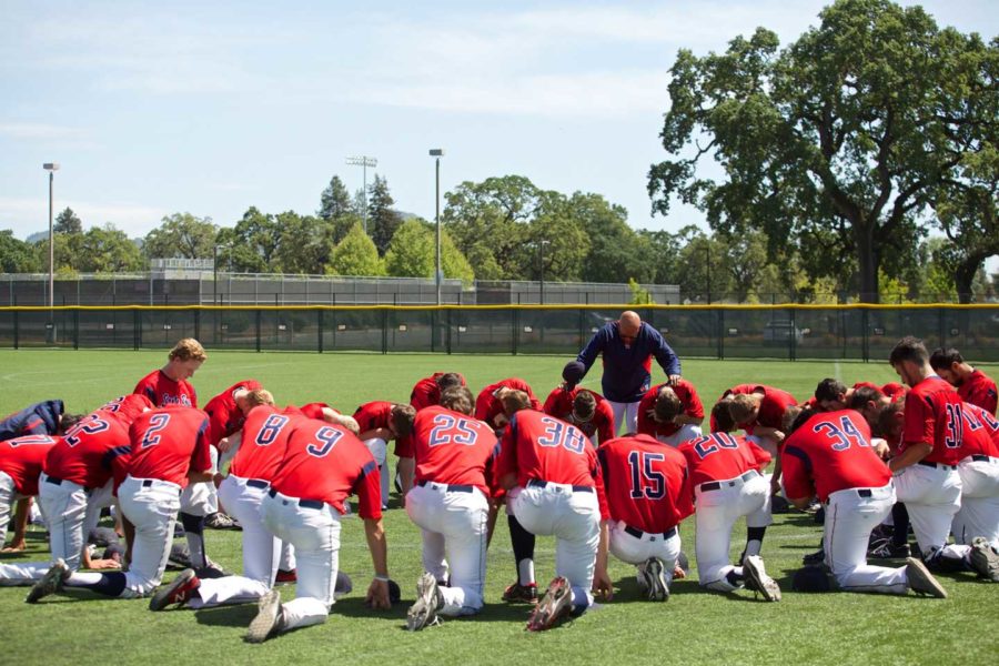 Tom+Francois+bows+his+head%2C+along+with+SRJC+Baseball+in+a+moment+of+reflection+before+the+final+regular+season+game+of+2015%2C+against+Sierra+College+April+24+at+Sypher+Field.