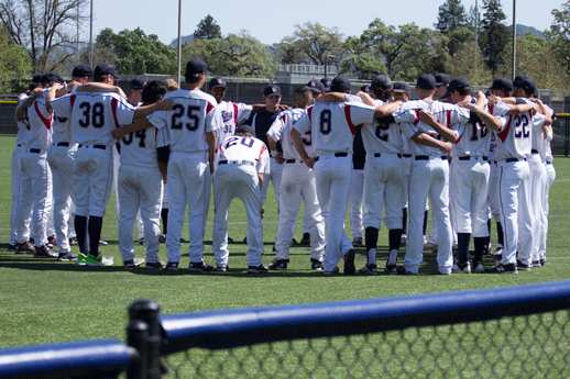 The Bear Cubs stand in a huddle after their victory against the Hawks of Consumnes River College March 31 at Cook-Sypher Field.