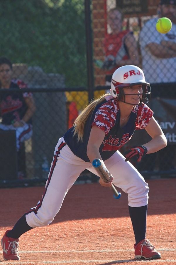 Becca+Stenier+lays+down+a+bunt+to+get+on+first+base+against+Butte+College+Feb.+21+at+Marv+Mays+Field.