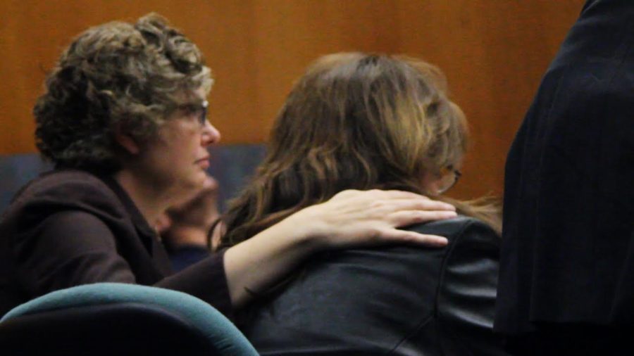 Karen Holzworth being comforted as she cries during her sentencing.  