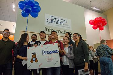 Jordan Panana Carbajal stands with fellow DREAMers during the opening event of the Dream Center. 