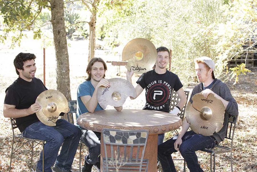 Eye For I members display cymbals destroyed by their drummer during shows and practice. Members left to right: Kyle Lino, Daniel Townsend, Nick Carico and Jack Buller. 