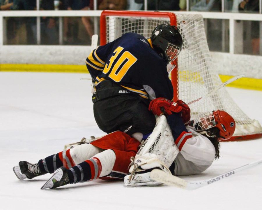 A UC Berkeley goaltender tackles former SRJC forward Chris Whitten after the Polar Bears’ center attacked the net attempting to score. The two engaged in a heated scrum before officials pulled the skaters apart and penalized both teams.