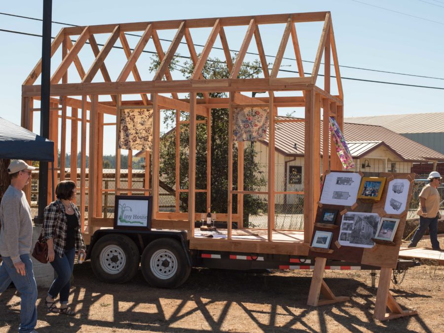 The Tiny House Club hosts a demo at Shone Farm Fall Festival featuring the skeleton of a tiny house and photos of constructed ones.