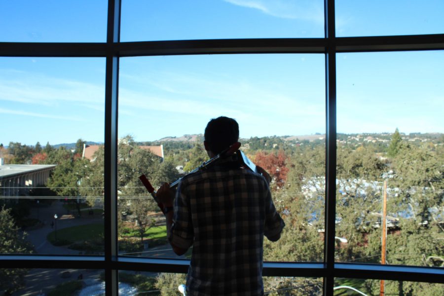 Adam Gockel coasts around SRJC campus by scooter. “It gets me places a lot faster than walking; cuts down [travel] time by over a half,” he said.