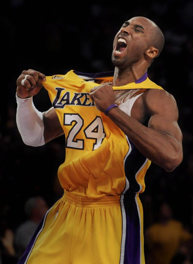 The Los angeles Lakers Kobe Bryant exhalts after a three point shot in a game that he finished with 49 points and a 2 games to none lead over the Denver Nuggets in a NBA Western conference play-off game.