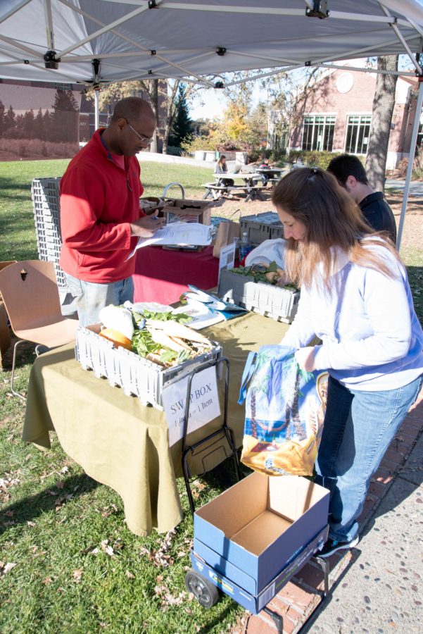 CSA members pick up food they ordered from Shone Farm every Wednesday and Thursday at Bertolini quad. 