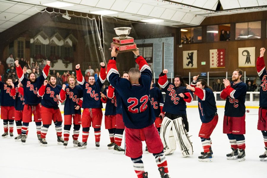 SRJC hockey captain Josiah Nikkel raises the Pacific Collegiate Hockey Association championship cup to his cheering teammates. The Polar Bears hockey team beat UC Davis for their fourth straight division title win. 